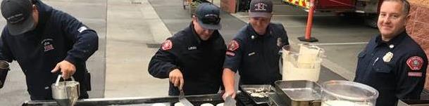 fire fighters self-serving themselves breakfast