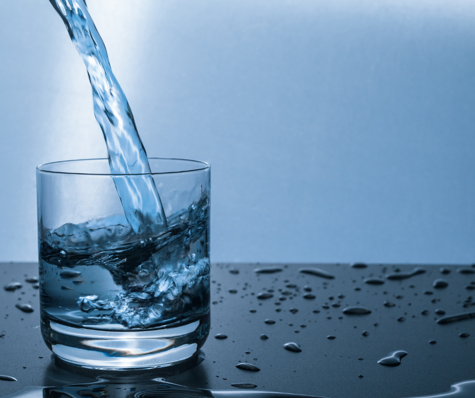 water being poured in a glass cup