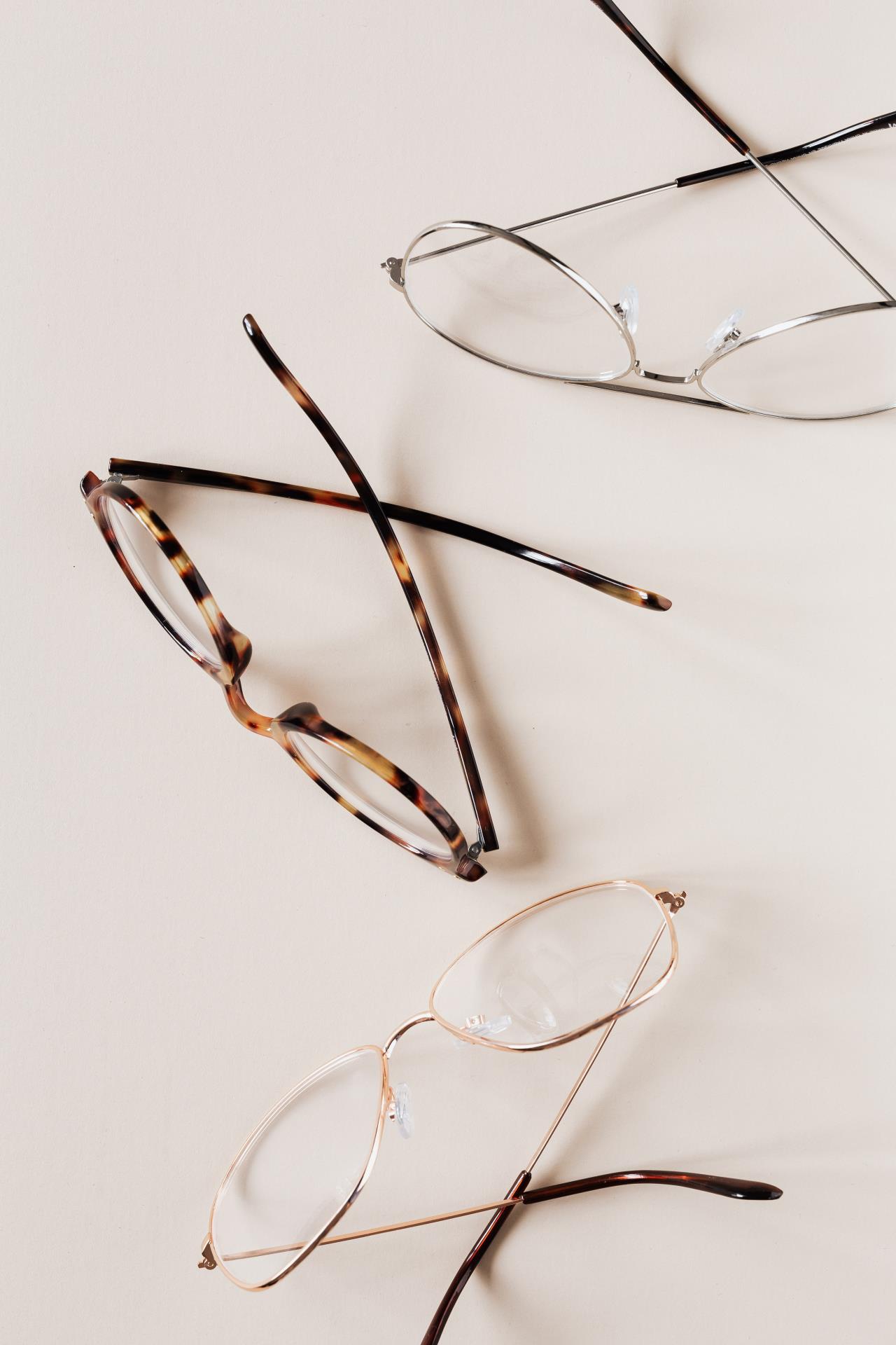 Three pairs of topsy turvy eyeglasses with beige background - Photo by Karolina Grabowska from Pexels