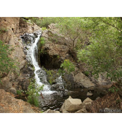 beautiful image of reservoir canyon with streaming waterfall