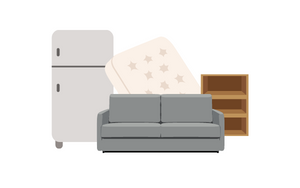 A pile of bulky items including a refrigerator, a couch, a shelf, and a mattress