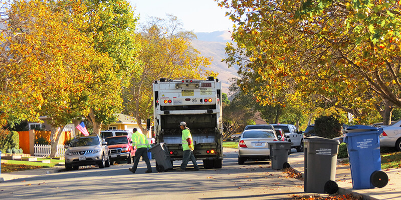 San Luis Garbage Company collecting trash at residential area