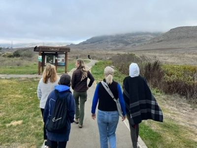 Parks & Recreation's SLO Hikers Group walking on a SLO Open Space trail being led by a Ranger