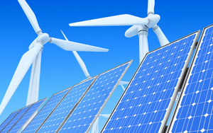 A picture of solar panels in the foreground, and solar fans in the background