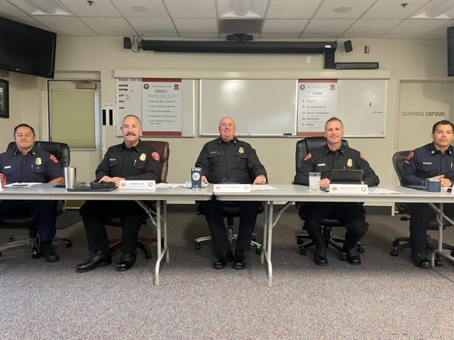 Picture of Fire Personnel Sitting at a Table