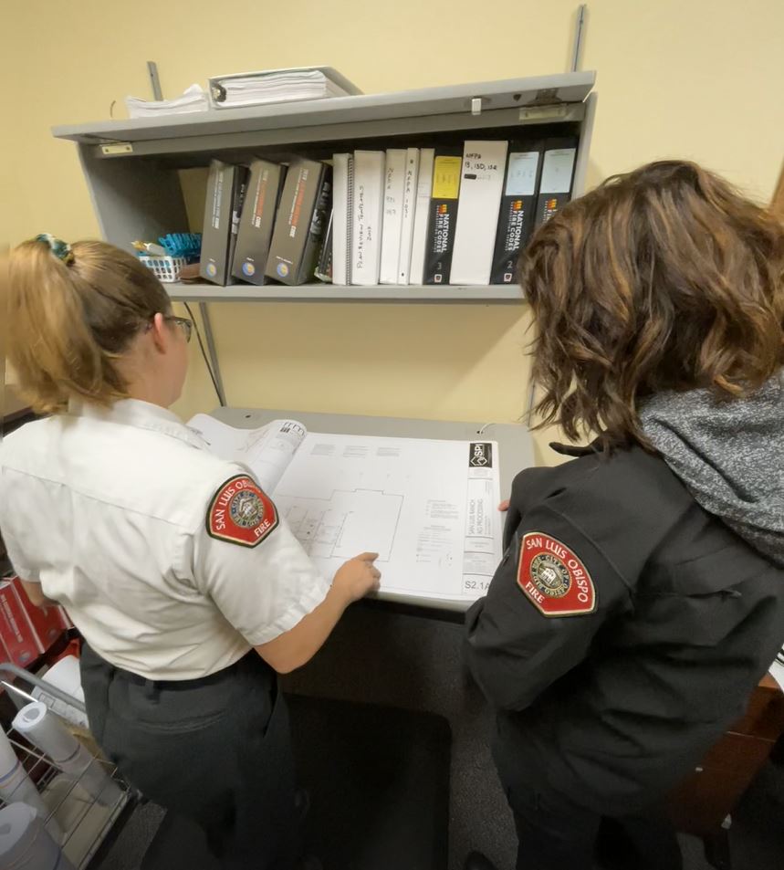 Picture of 2 Fire Inspectors Reviewing Plans