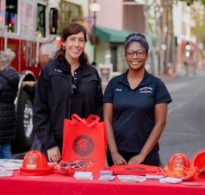 2 Fire prevention staff in front of informational table