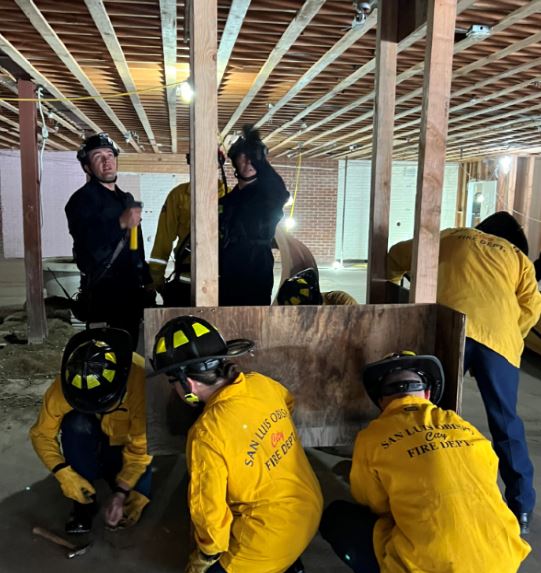 Multiple firefighters in a building