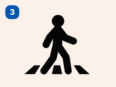 An icon of a pedestrian using a crosswalk