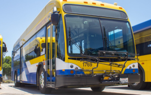 A picture of the front of a SLO Transit bus on the bus yard in San Luis Obispo