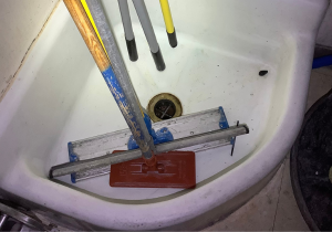 Mop sink with mop inside