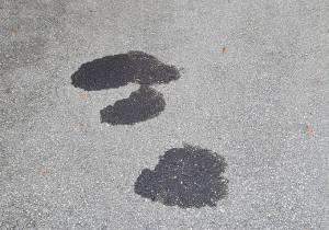 Oil stains on asphalt surface