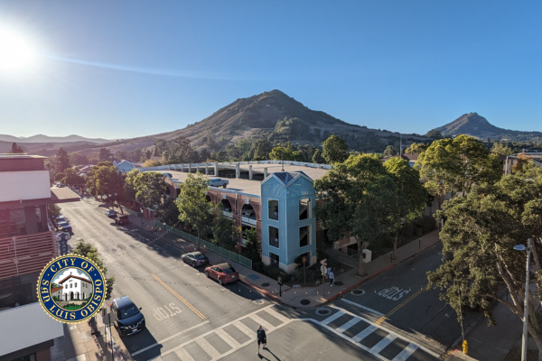 A parking structure on Palm Street with Cerro San Luis in the background. 