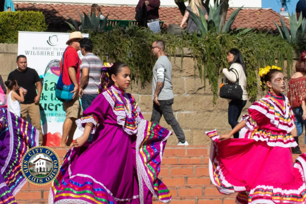 young girls dancing traditionally for Dia de los muertos