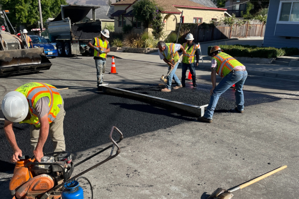 A picture of a construction crew doing pavement work on a street in San Luis Obispo as part of SLO in Motion