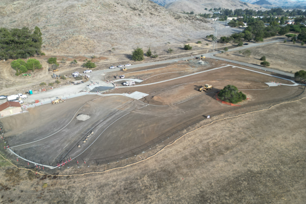 An aerial picture of San Luis Obispo's Laguna Lake Dog Park construction showing the newly installed perimeter and sidewalks