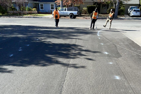 A picture of striping marks on a newly slurry sealed street in San Luis Obispo