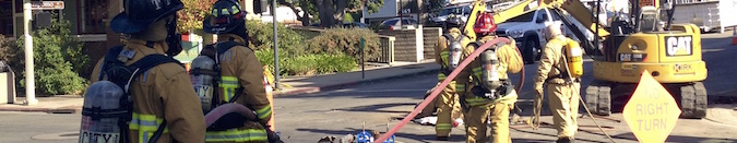 firefighters combating gas leak in the City