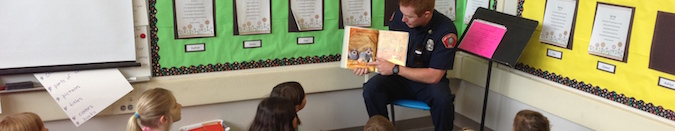 police officer reading to kids banner