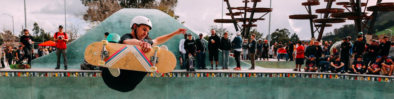 young adult doing a trick on a skateboard